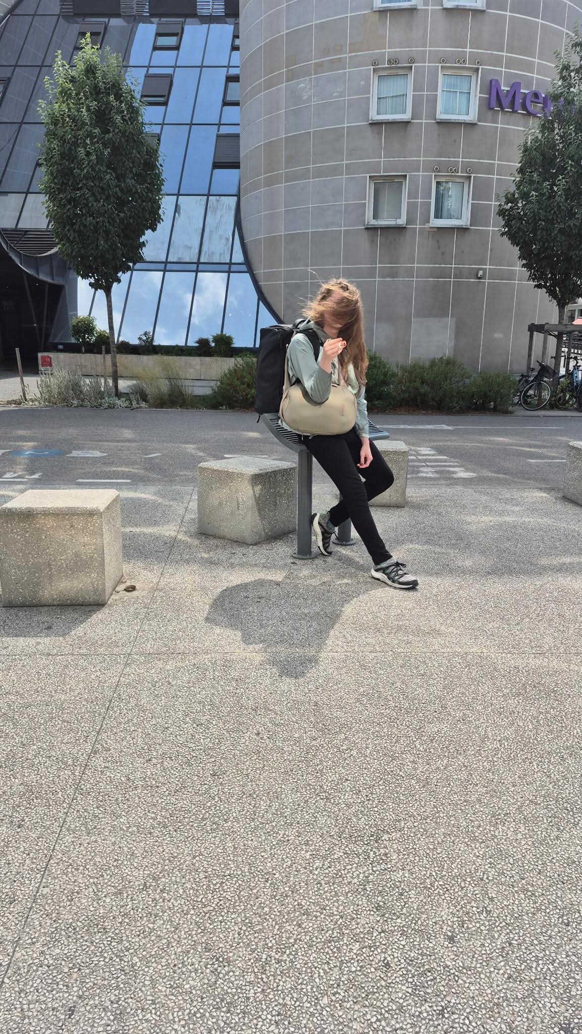 Ashley Kalkowski outdoors beside modern architecture